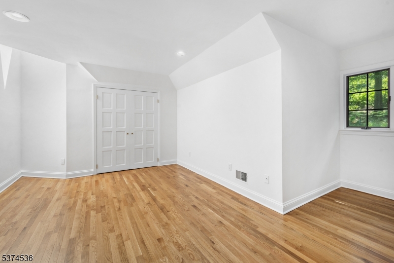 201 Dryden Road Bernardsville, NJ 07924 - Photo 29 of 48 a view of an empty room with wooden floor