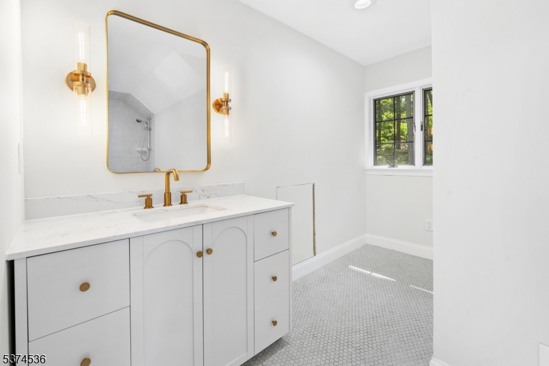 201 Dryden Road Bernardsville, NJ 07924 - Photo 30 of 48 a bathroom with a sink mirror and vanity