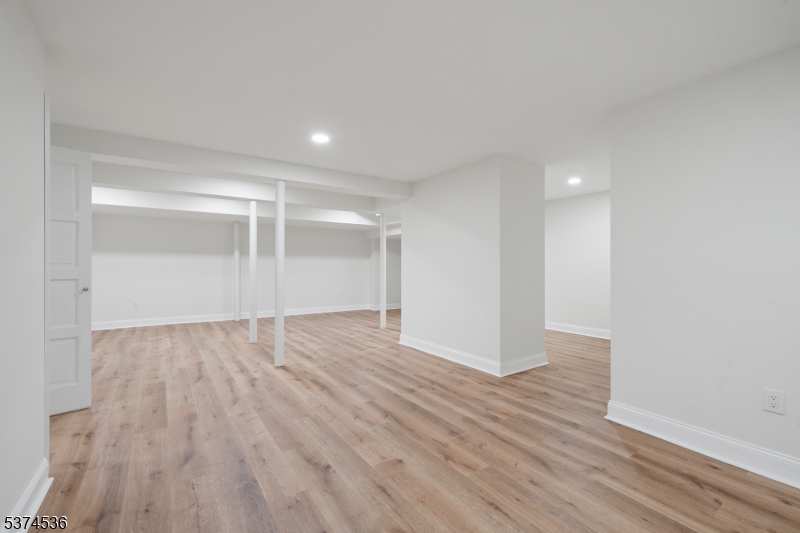 201 Dryden Road Bernardsville, NJ 07924 - Photo 37 of 48 a view of an empty room with wooden floor