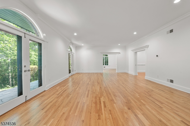 201 Dryden Road Bernardsville, NJ 07924 - Photo 4 of 48 a view of empty room with wooden floor and fan