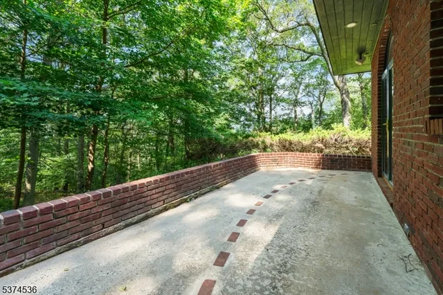a view of backyard with swimming pool