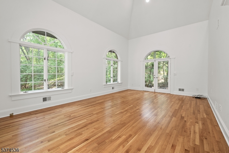 201 Dryden Road Bernardsville, NJ 07924 - Photo 6 of 48 wooden floor in an empty room with a window