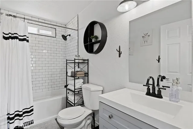 a room with furniture pool table and a projector screen