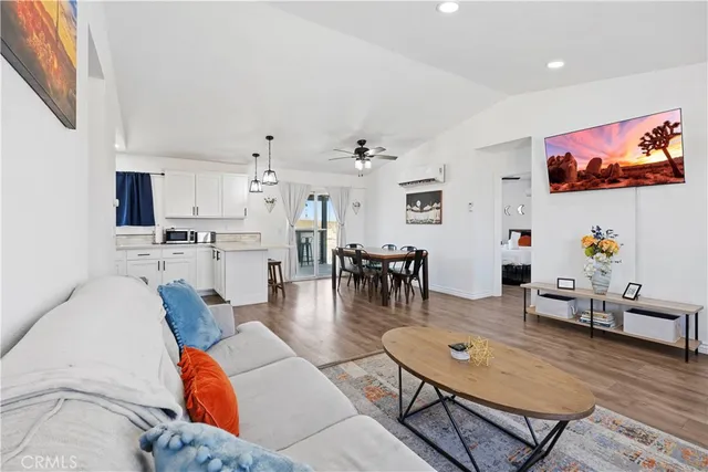 a kitchen with stainless steel appliances a stove a sink and cabinets