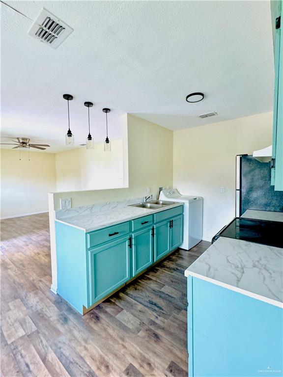 1620 West Samano Street Edinburg, TX 78539 - Photo 13 of 39 a kitchen with sink and cabinets
