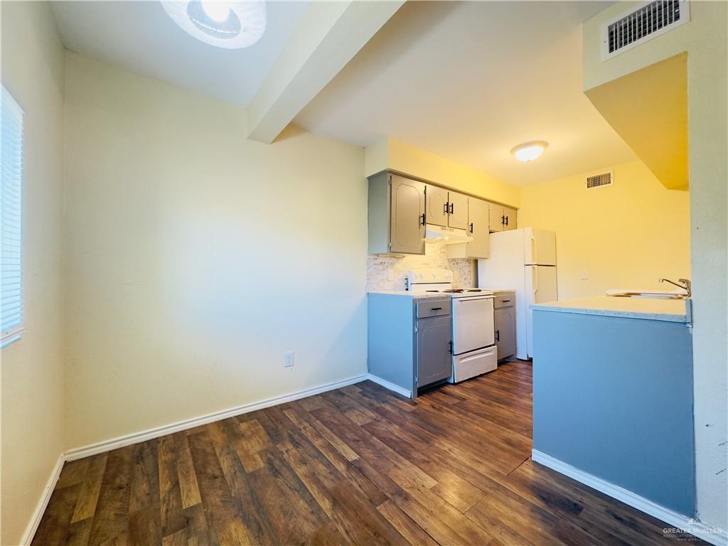 1620 West Samano Street Edinburg, TX 78539 - Photo 15 of 39 a view of a kitchen with wooden floor