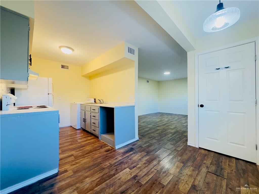 1620 West Samano Street Edinburg, TX 78539 - Photo 16 of 39 a view of a kitchen cabinets and wooden floor