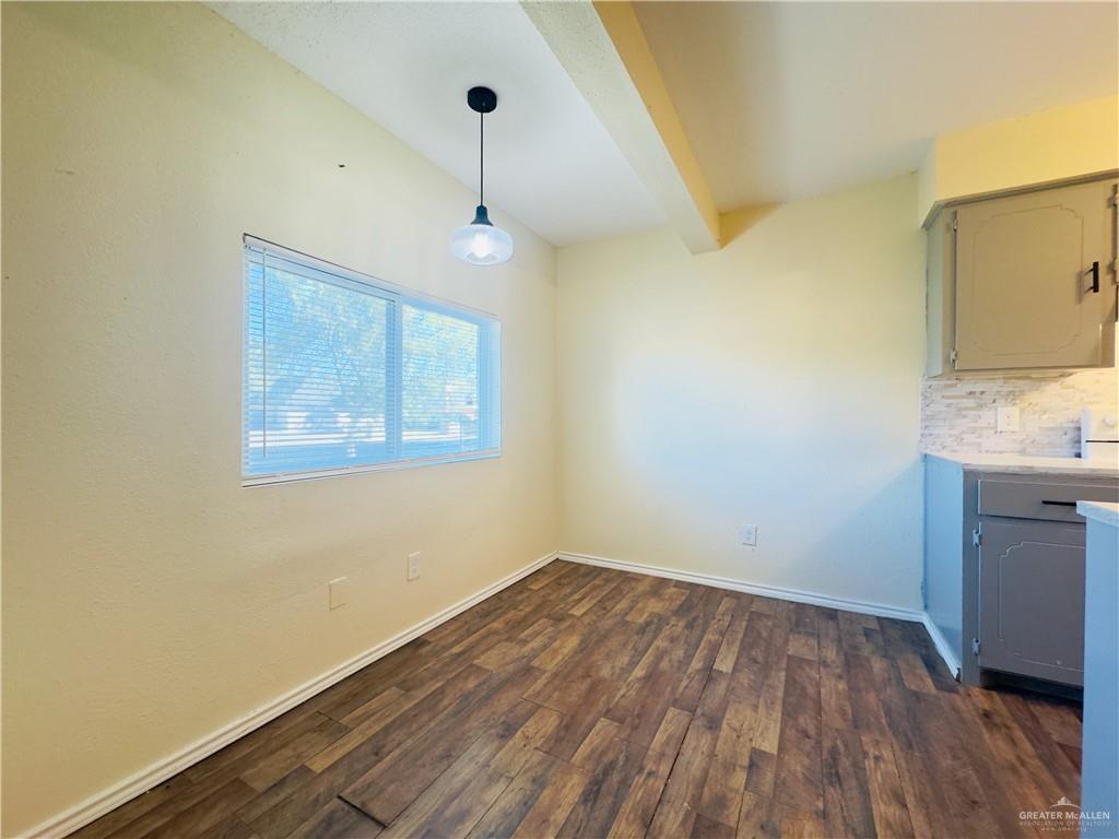 1620 West Samano Street Edinburg, TX 78539 - Photo 17 of 39 a view of a room with wooden floor and a ceiling fan