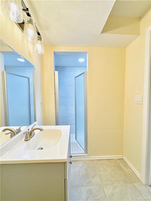 1620 West Samano Street Edinburg, TX 78539 - Photo 25 of 39 a bathroom with a sink and a mirror
