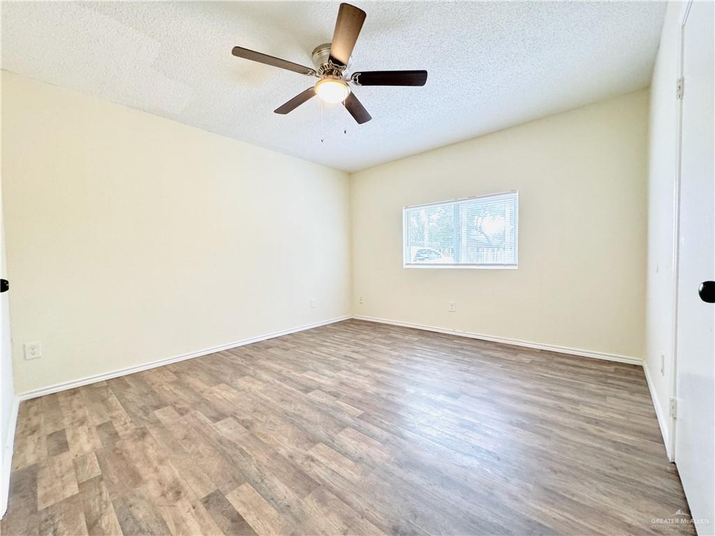 1620 West Samano Street Edinburg, TX 78539 - Photo 31 of 39 wooden floor in an empty room