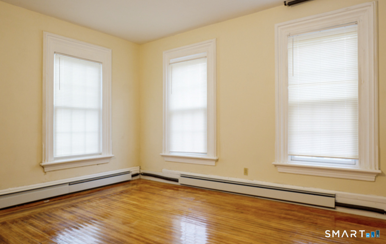 30 Main Street Plainfield, CT 06332 - Photo 4 of 14 an empty room with window