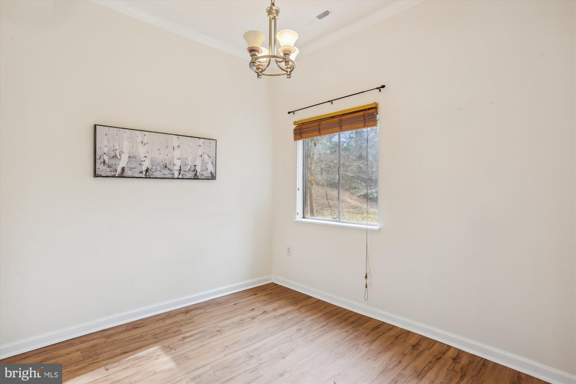18612 Walkers Choice Road, Unit 1 Montgomery Village, MD 20886 - Photo 11 of 42 a view of an empty room with a window