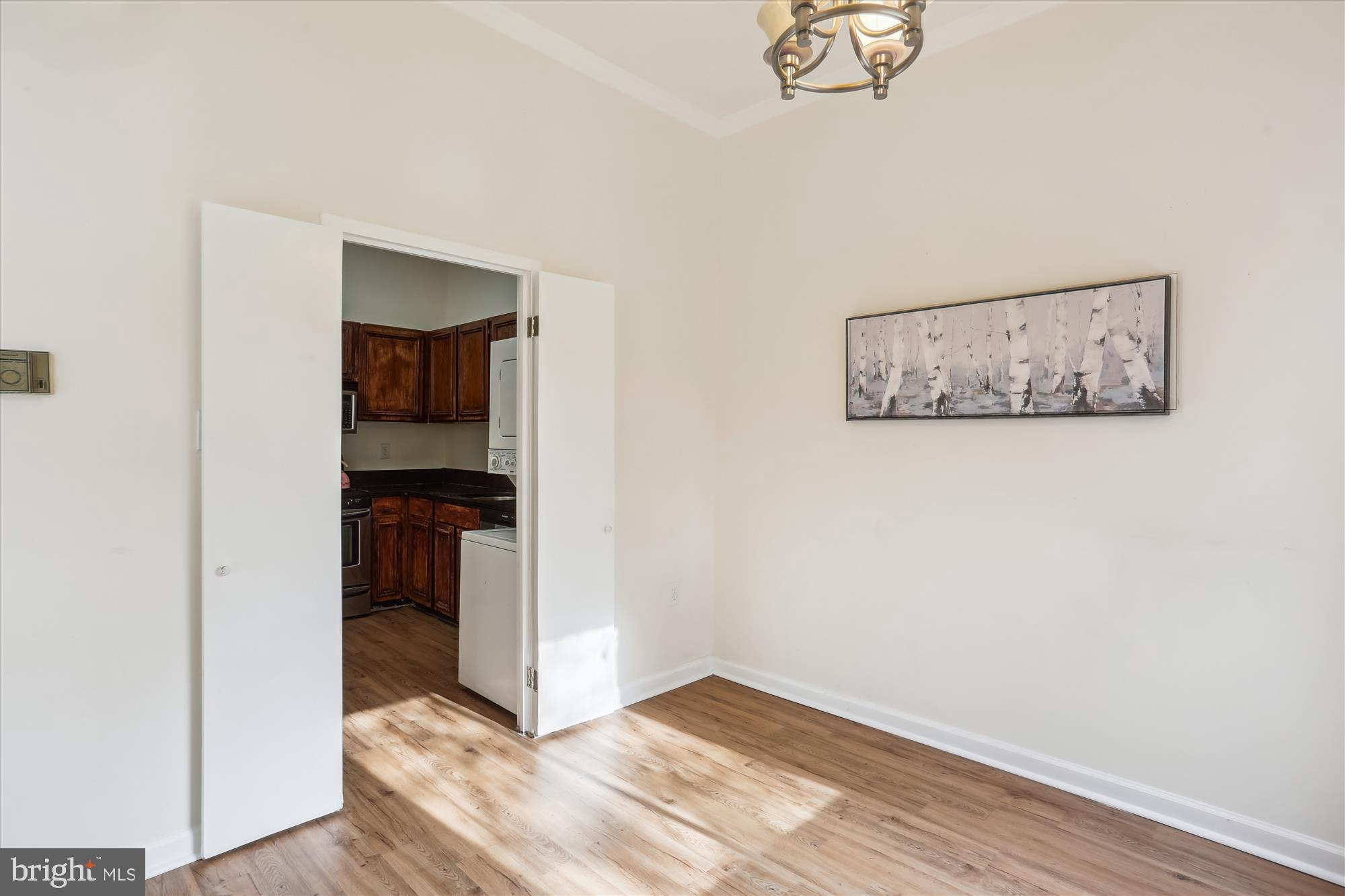 18612 Walkers Choice Road, Unit 1 Montgomery Village, MD 20886 - Photo 12 of 42 a view of a hallway with wooden floor and closet