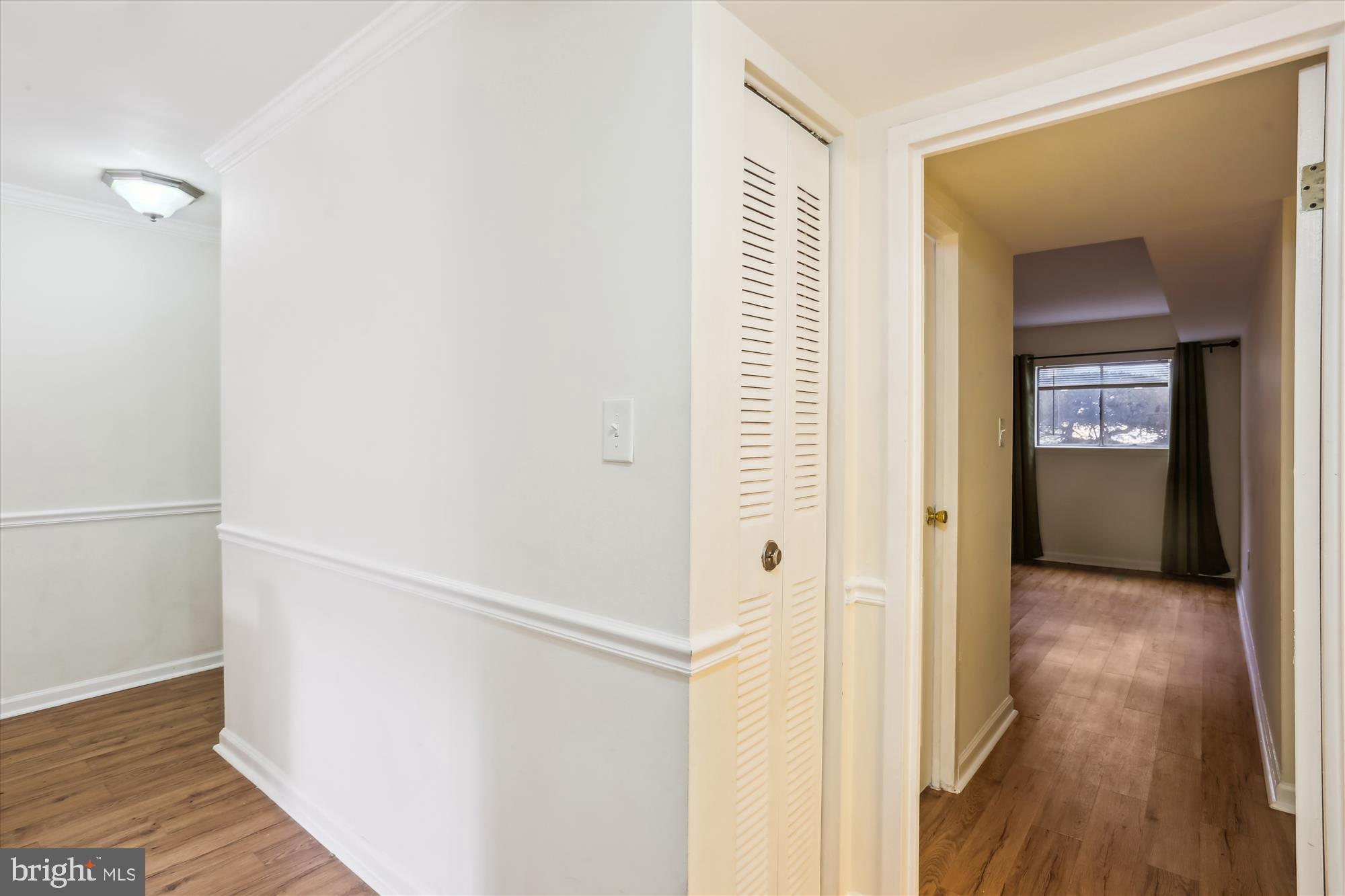 18612 Walkers Choice Road, Unit 1 Montgomery Village, MD 20886 - Photo 16 of 42 a view of hallway with wooden floor
