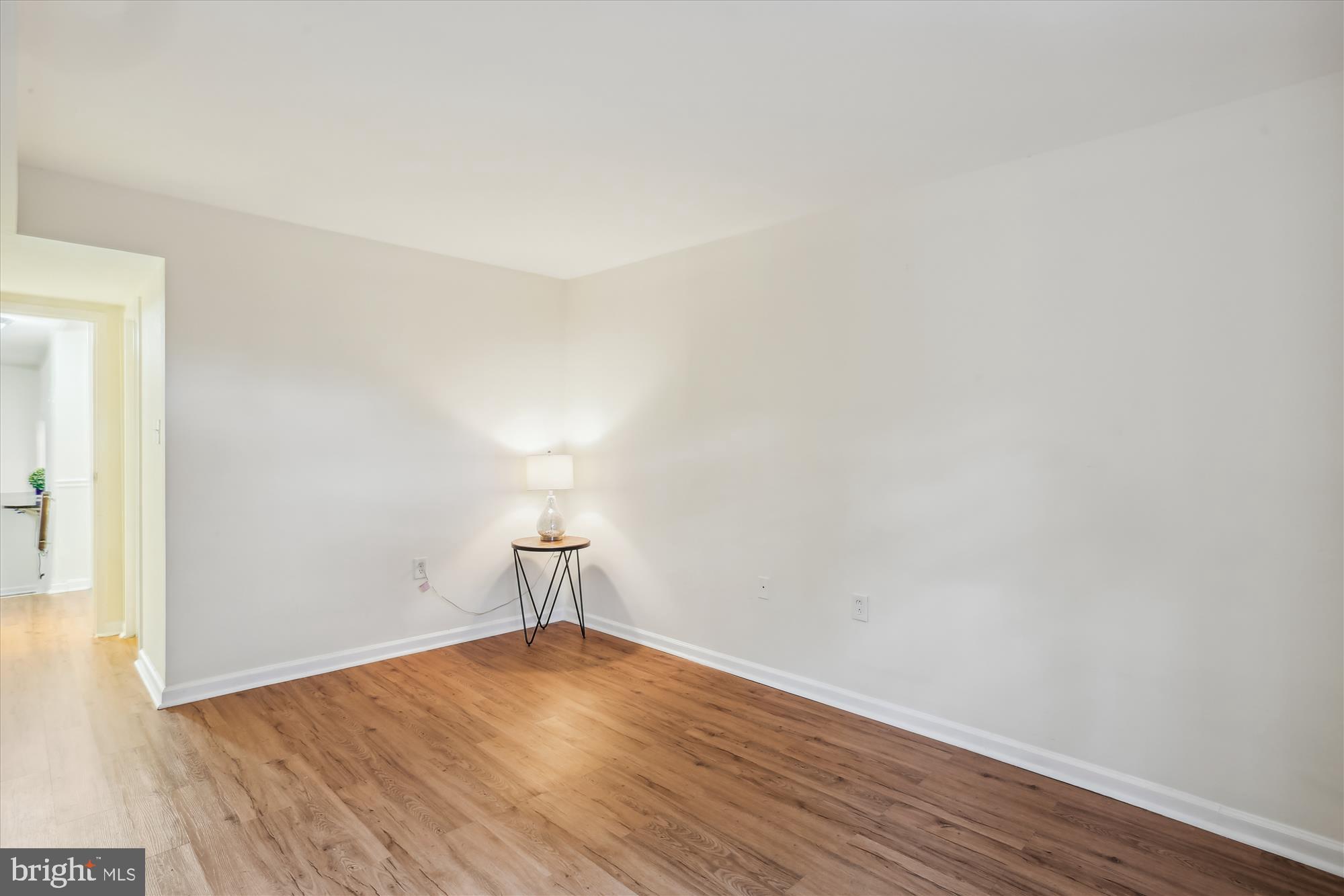 18612 Walkers Choice Road, Unit 1 Montgomery Village, MD 20886 - Photo 19 of 42 a view of empty room with wooden floor