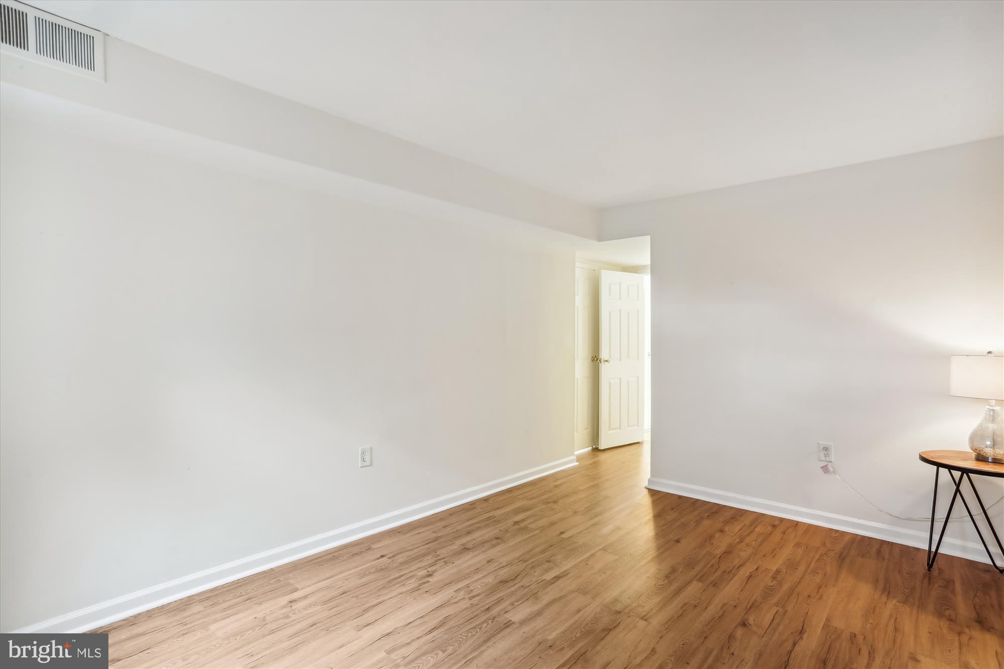 18612 Walkers Choice Road, Unit 1 Montgomery Village, MD 20886 - Photo 20 of 42 a view of an empty room with wooden floor