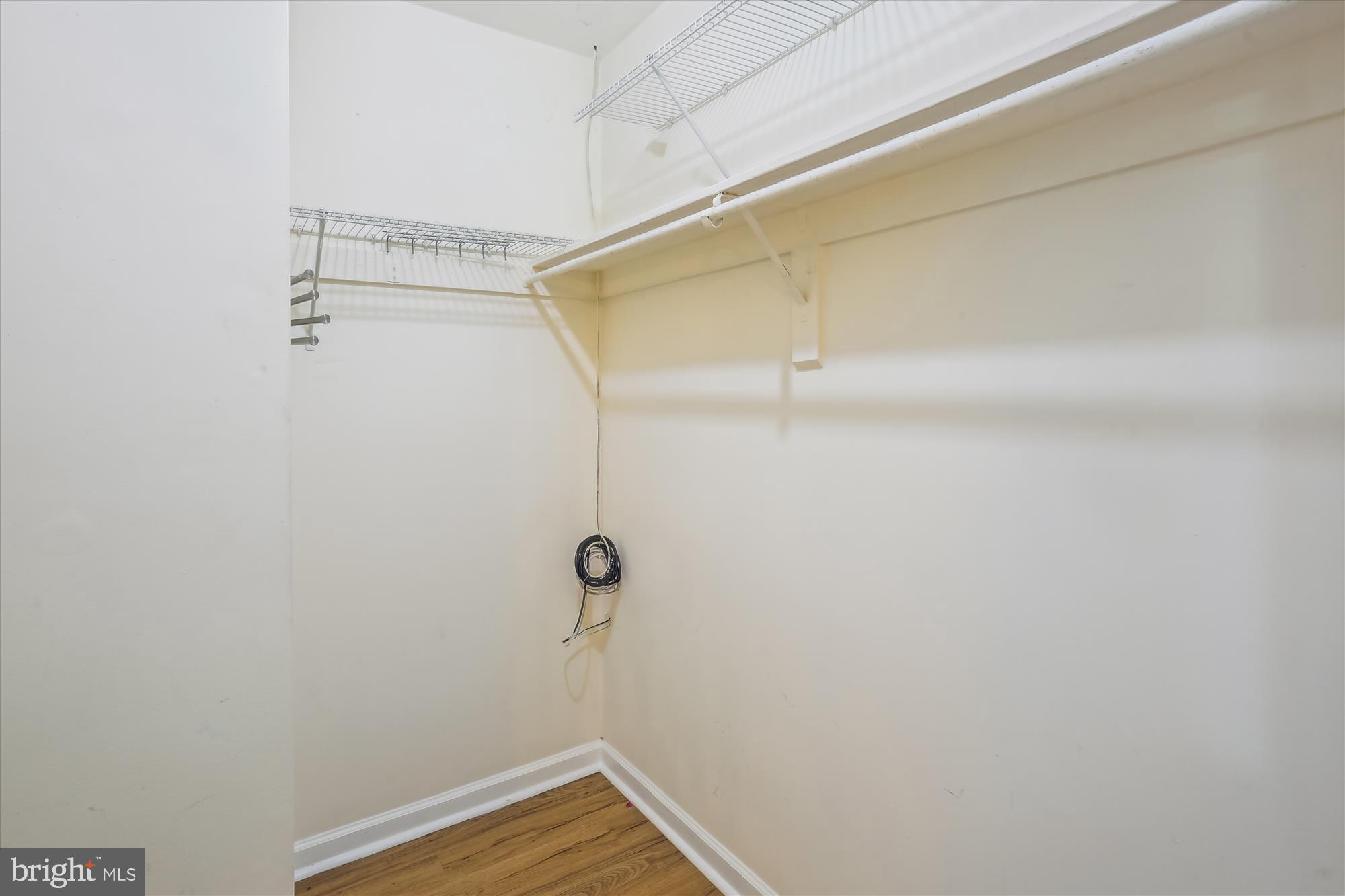 18612 Walkers Choice Road, Unit 1 Montgomery Village, MD 20886 - Photo 21 of 42 a view of a room with racks on the wall