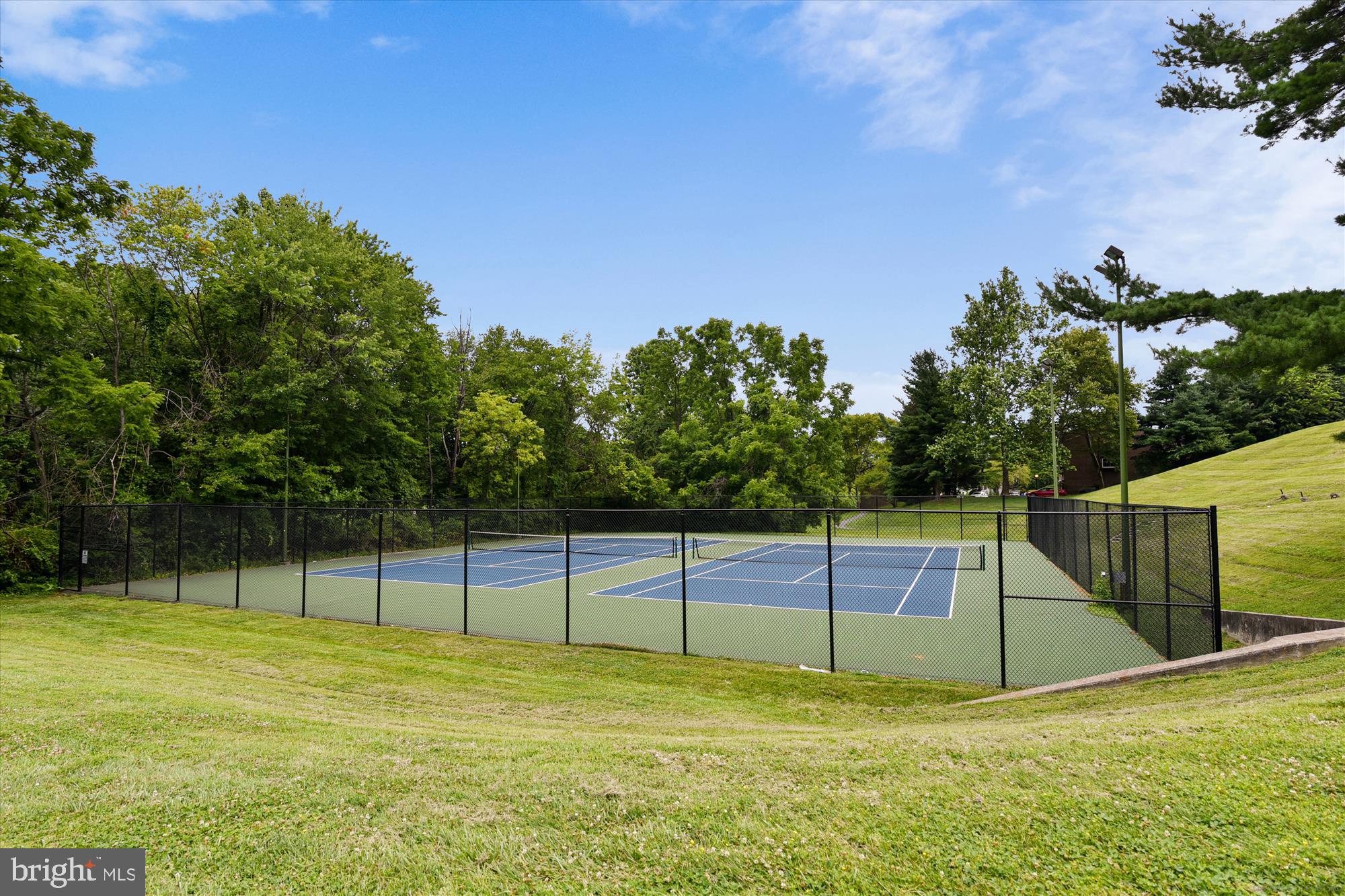 18612 Walkers Choice Road, Unit 1 Montgomery Village, MD 20886 - Photo 28 of 42 a view of a tennis court