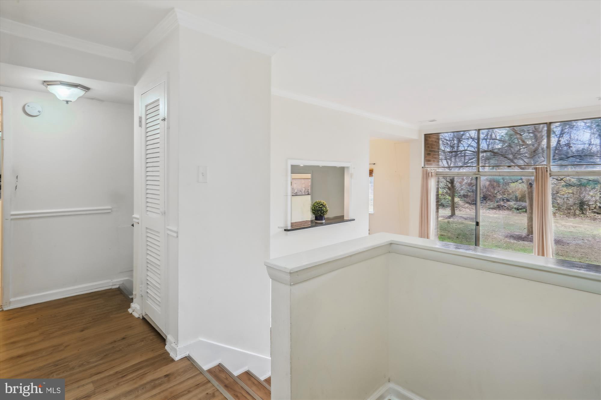 18612 Walkers Choice Road, Unit 1 Montgomery Village, MD 20886 - Photo 3 of 42 a view of empty room with wooden floor and fan