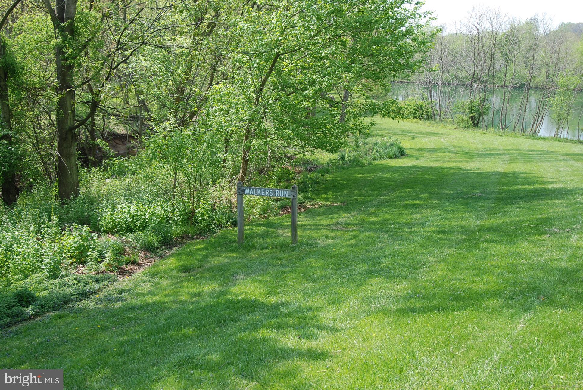 18612 Walkers Choice Road, Unit 1 Montgomery Village, MD 20886 - Photo 40 of 42 a view of a green field with a tree