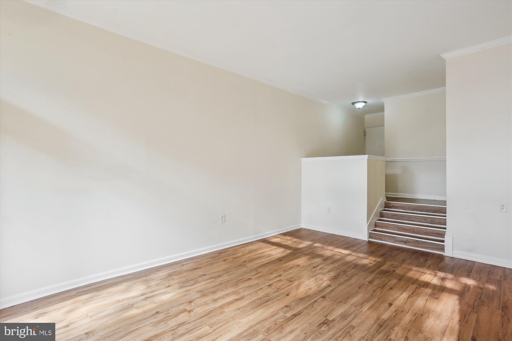 18612 Walkers Choice Road, Unit 1 Montgomery Village, MD 20886 - Photo 6 of 42 a view of empty room with wooden floor