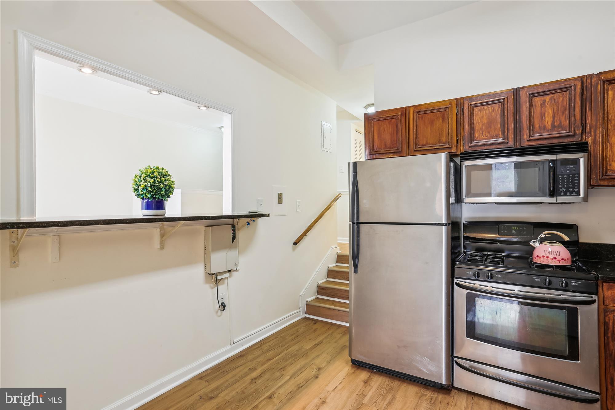 18612 Walkers Choice Road, Unit 1 Montgomery Village, MD 20886 - Photo 8 of 42 a kitchen with stainless steel appliances a refrigerator and a stove top oven
