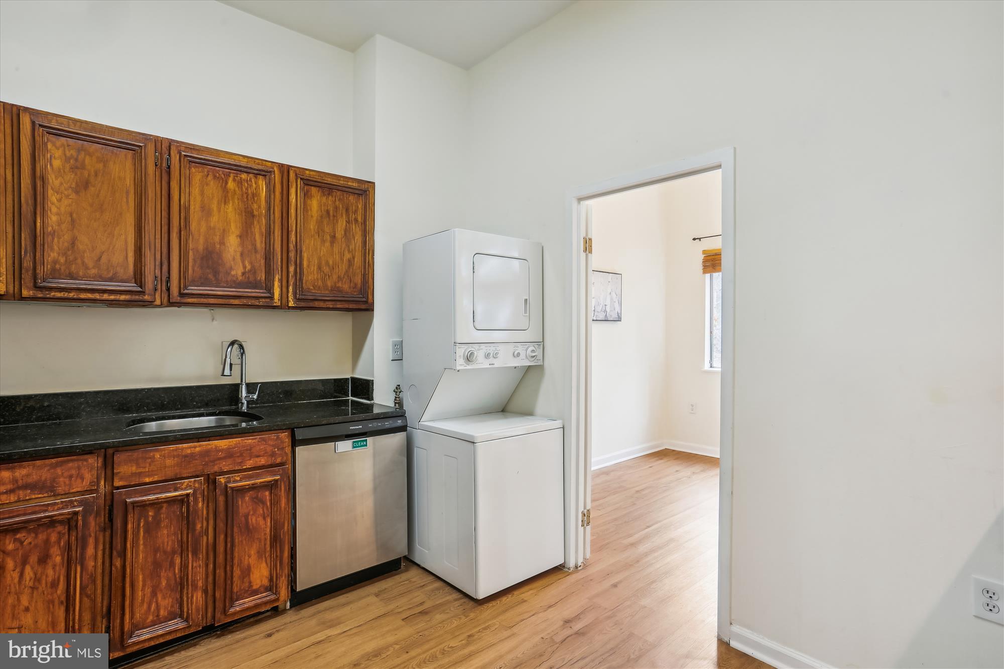18612 Walkers Choice Road, Unit 1 Montgomery Village, MD 20886 - Photo 10 of 42 a kitchen with granite countertop a sink and cabinets