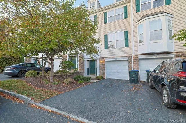 a view of a car park in front of house