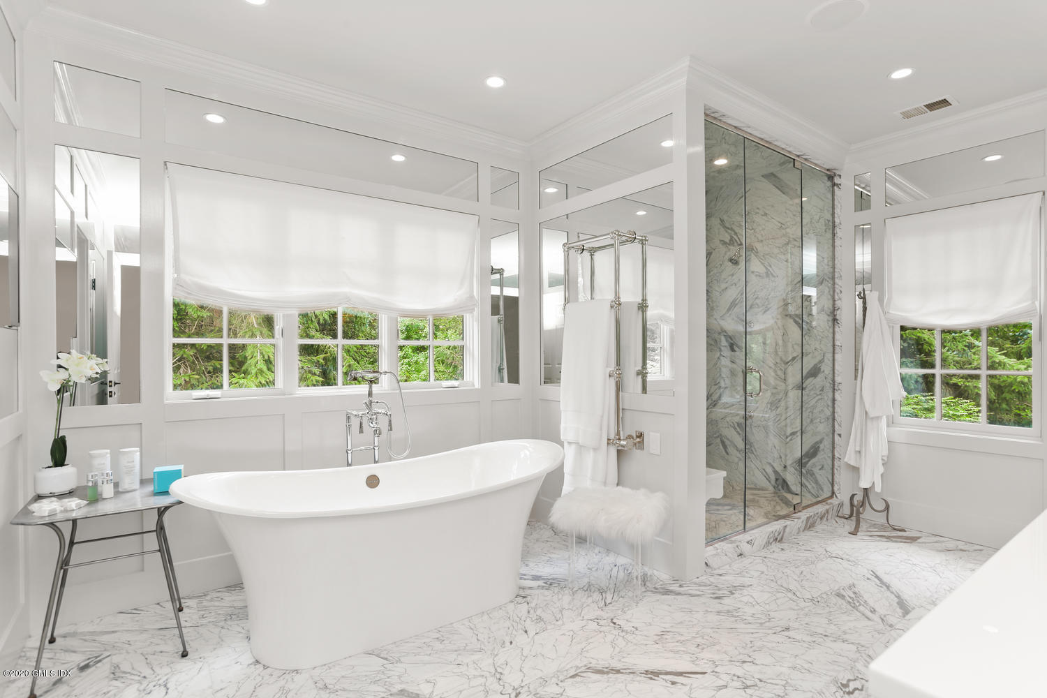 18 Chieftans Road Greenwich, CT 06831 - Photo 16 of 30 a spacious bathroom with a tub shower and windows