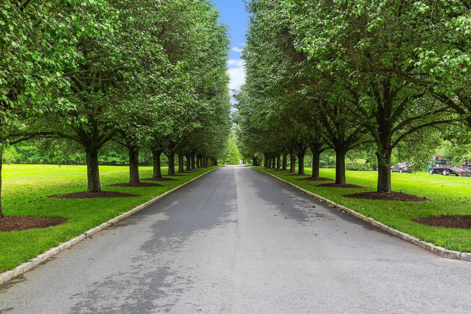 18 Chieftans Road Greenwich, CT 06831 - Photo 3 of 30 a view of road with grass and a trees