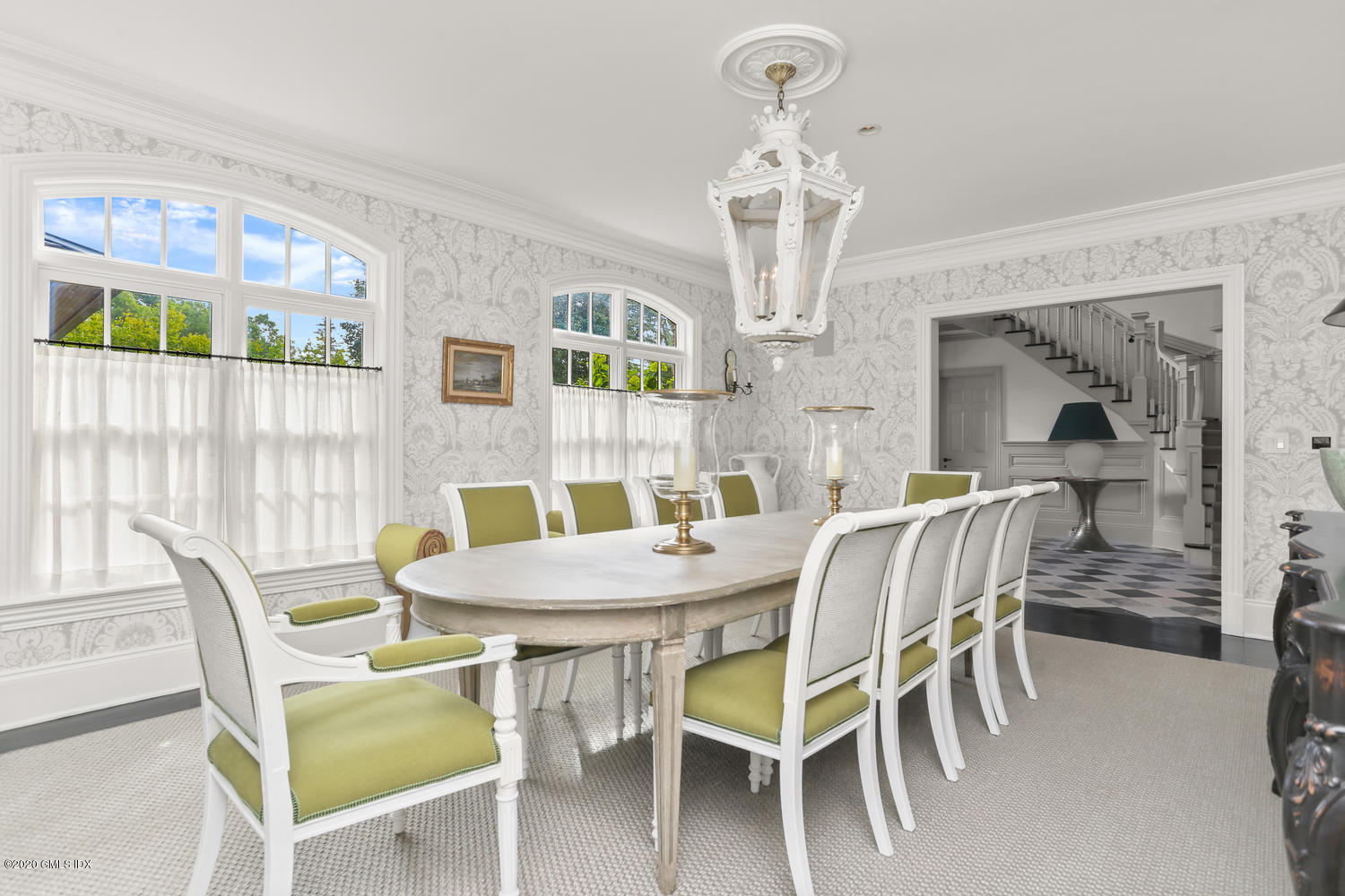 18 Chieftans Road Greenwich, CT 06831 - Photo 7 of 30 a view of a dining room with furniture a chandelier and wooden floor