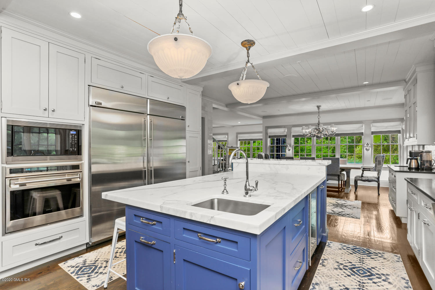 18 Chieftans Road Greenwich, CT 06831 - Photo 8 of 30 a kitchen with stainless steel appliances granite countertop a sink a stove and a refrigerator