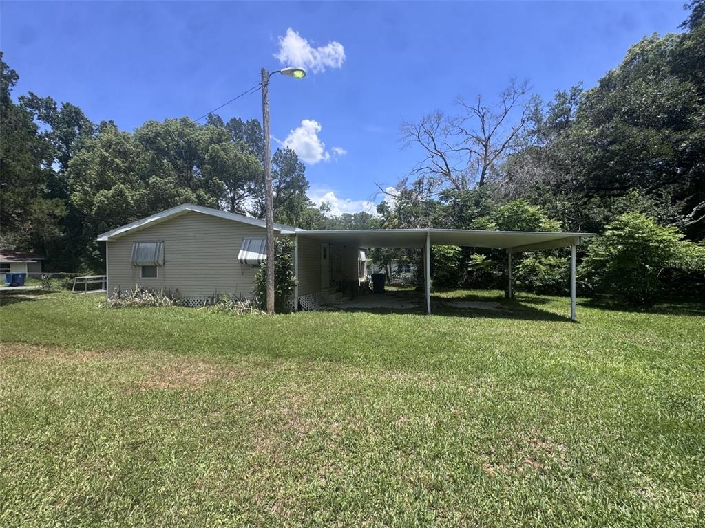 20050 Ruth Street Brooksville, FL 34601 - Photo 7 of 18 a view of a house with backyard