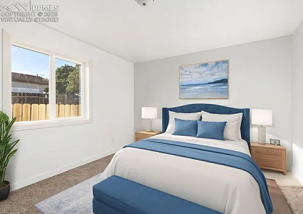 a bedroom with bed and wooden floor
