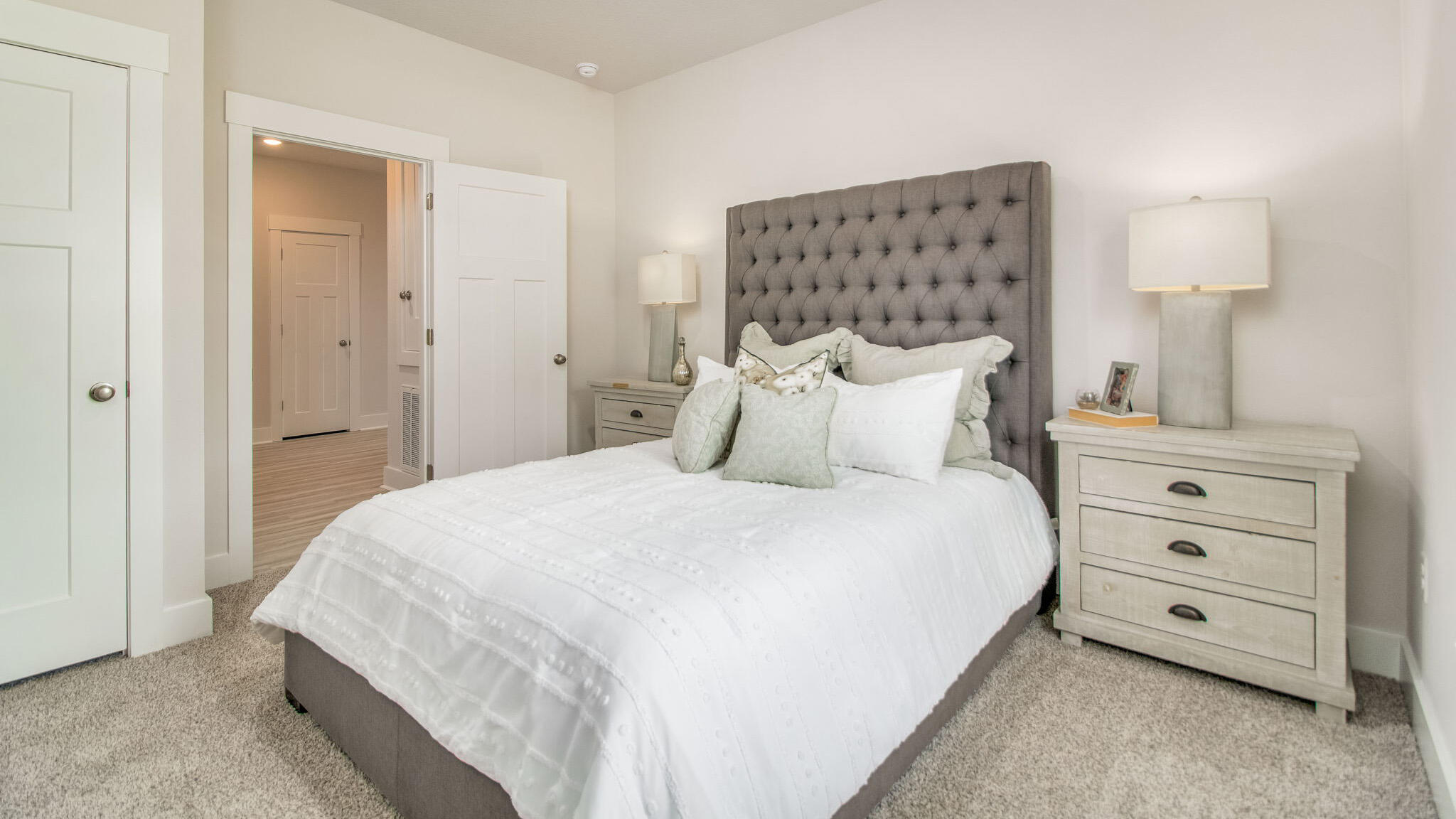 5841 Dove Nest Road Gulf Breeze, FL 32563 - Photo 22 of 30 a bedroom with a bed and a night stand