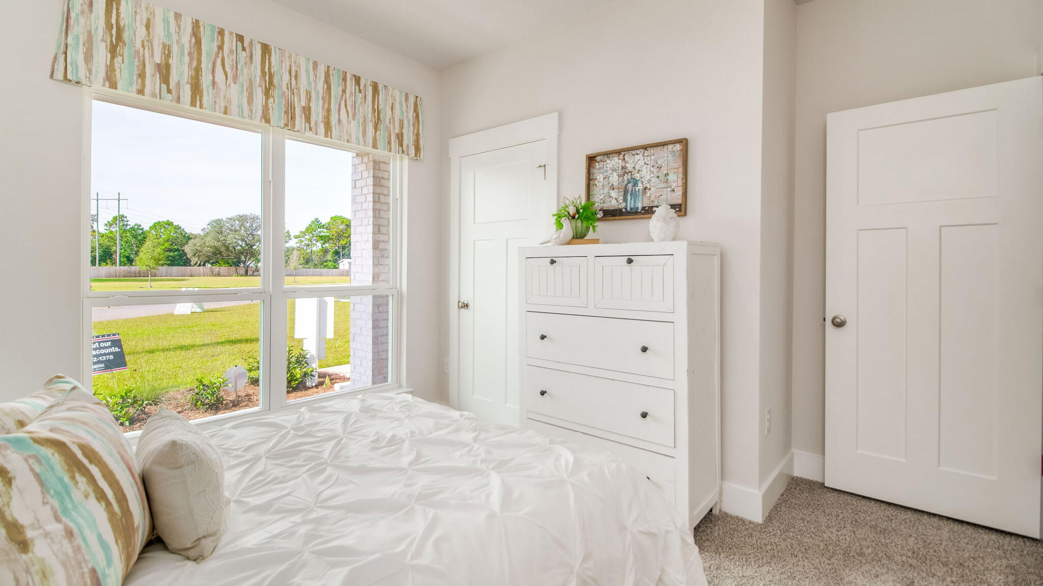 5841 Dove Nest Road Gulf Breeze, FL 32563 - Photo 27 of 30 a bedroom with a bed and a window