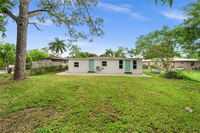 a view of green field with trees