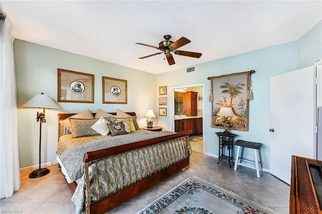 a bedroom with a bed and a table in it