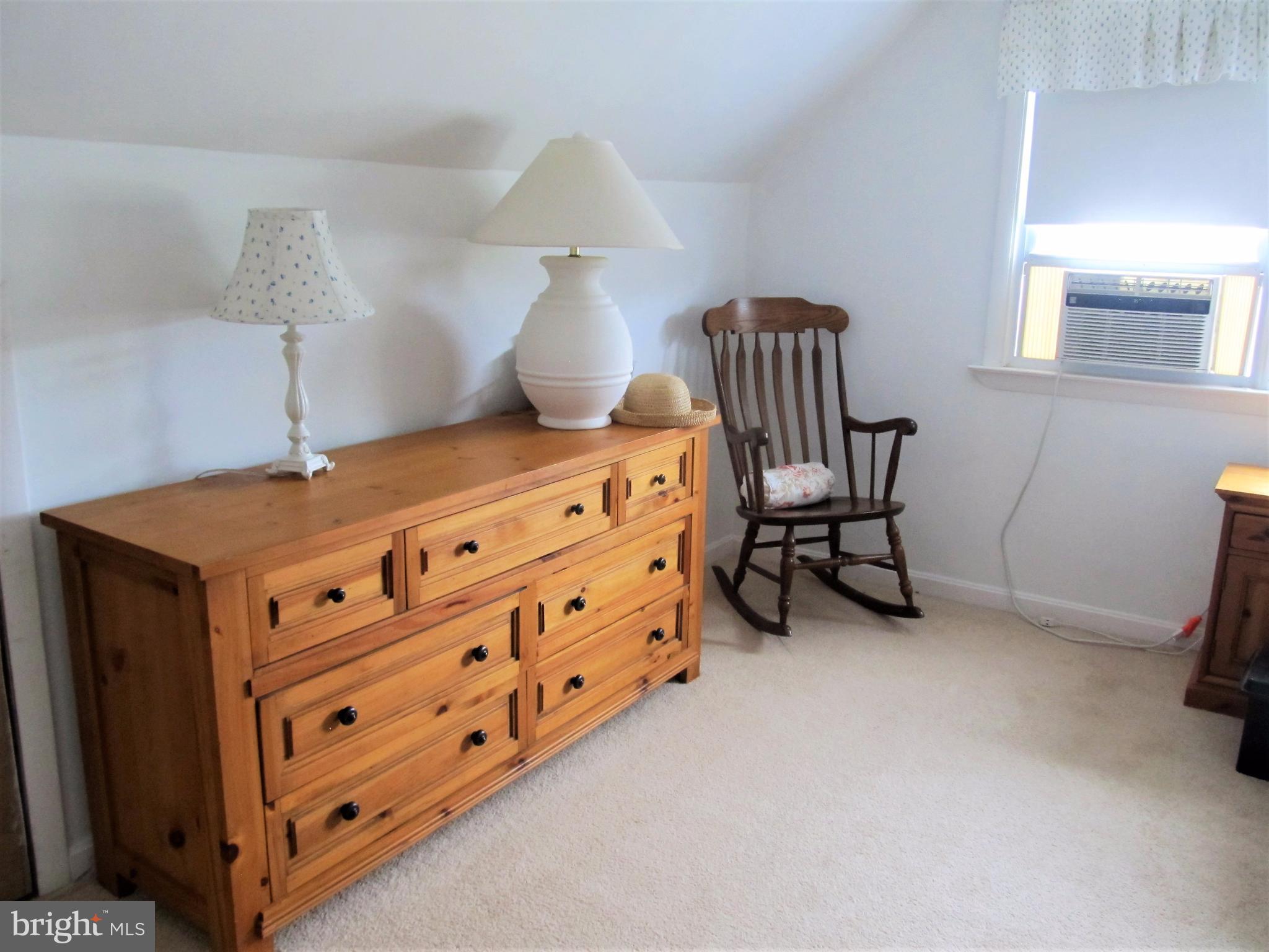 558 Fairmount Road Linthicum Heights, MD 21090 - Photo 13 of 30 a bedroom with a bed and a chair in it