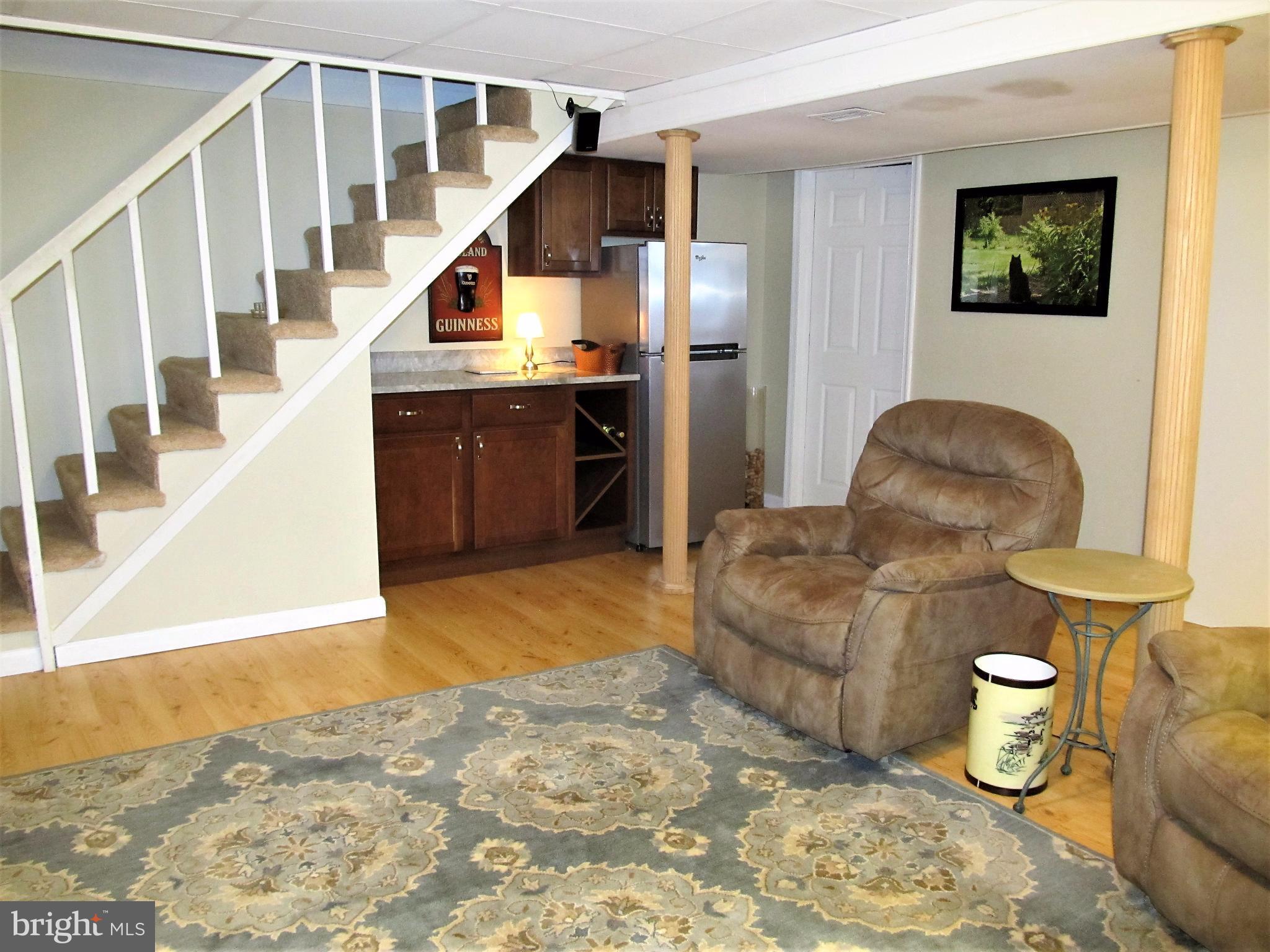558 Fairmount Road Linthicum Heights, MD 21090 - Photo 17 of 30 a living room with furniture and a flat screen tv