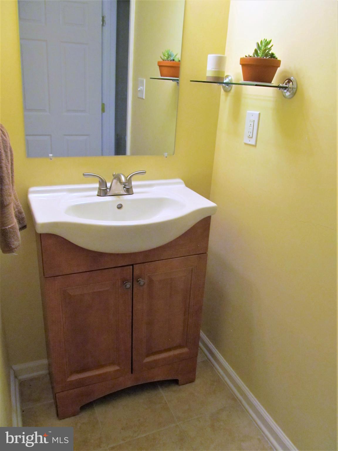 558 Fairmount Road Linthicum Heights, MD 21090 - Photo 20 of 30 a bathroom with a sink and a mirror