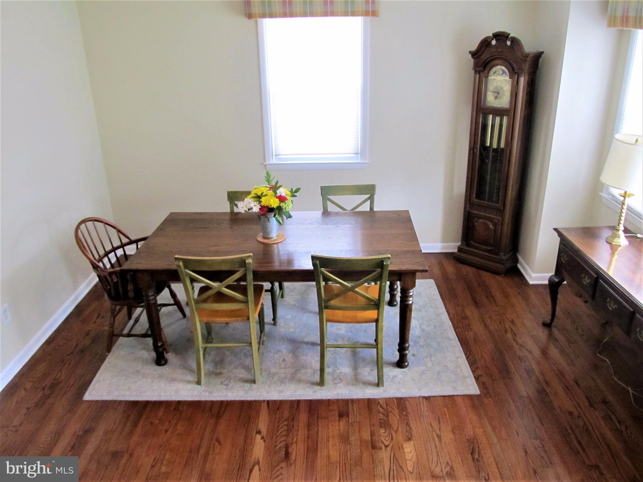 558 Fairmount Road Linthicum Heights, MD 21090 - Photo 3 of 30 a view of a dining room with furniture and wooden floor