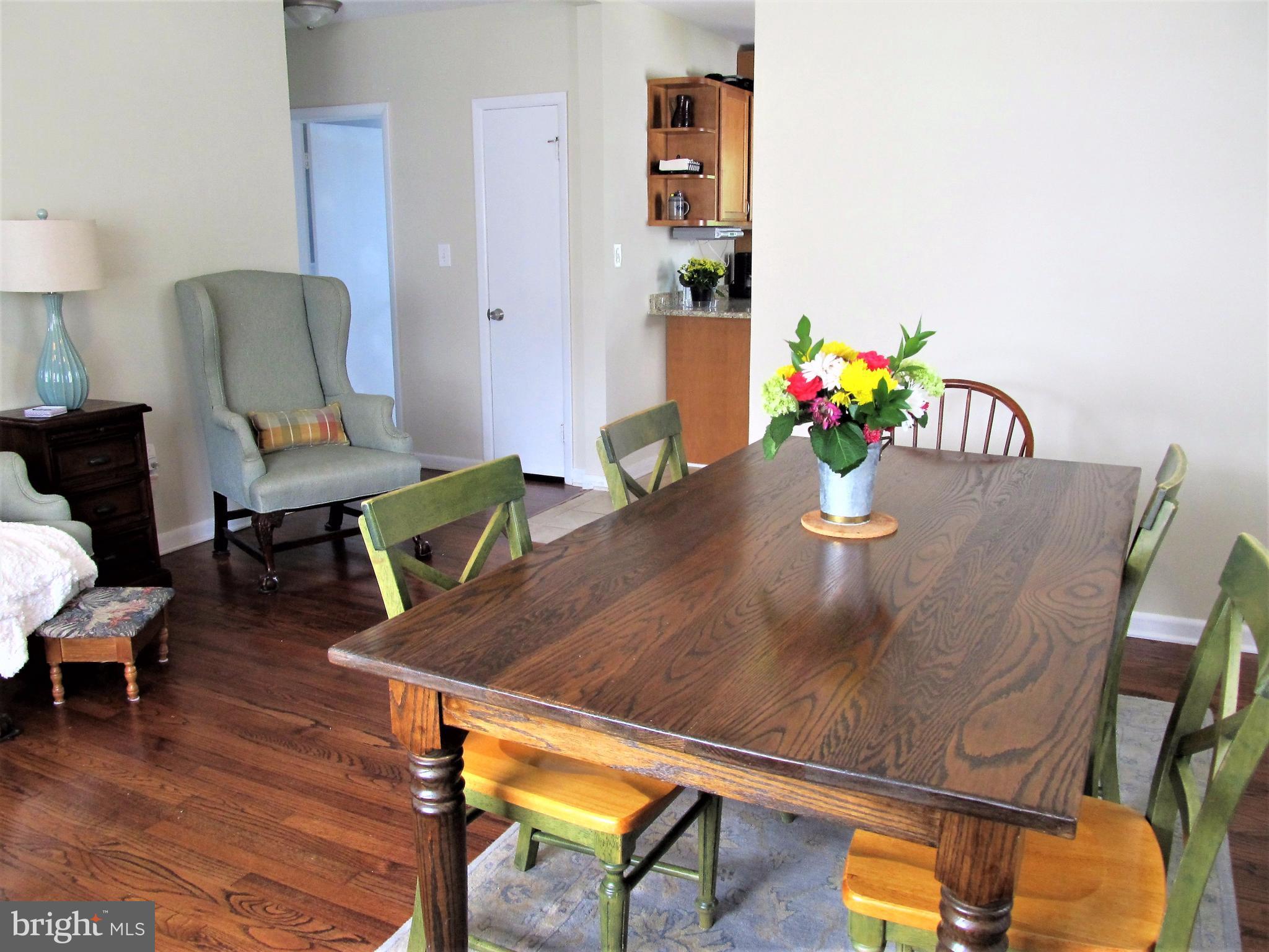 558 Fairmount Road Linthicum Heights, MD 21090 - Photo 4 of 30 a view of a dining room with furniture and wooden floor