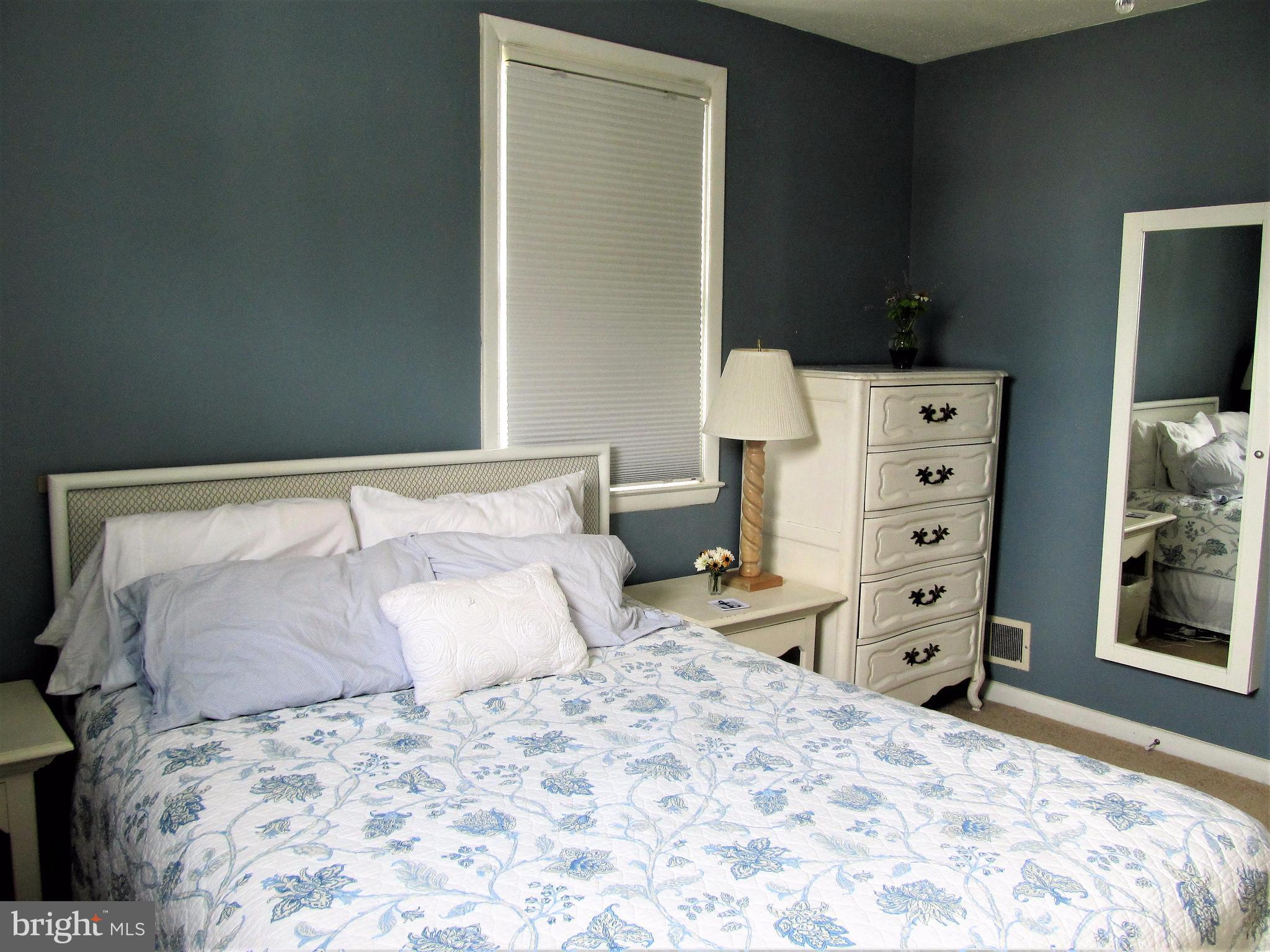 558 Fairmount Road Linthicum Heights, MD 21090 - Photo 9 of 30 a bedroom with a bed and a tv on the dresser