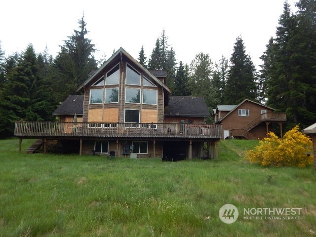 19312 Skinner Road Granite Falls, WA 98252 - Photo 2 of 23 a view of house with a garden and deck
