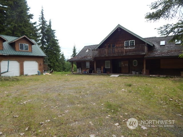 19312 Skinner Road Granite Falls, WA 98252 - Photo 4 of 23 a front view of a house with a garden