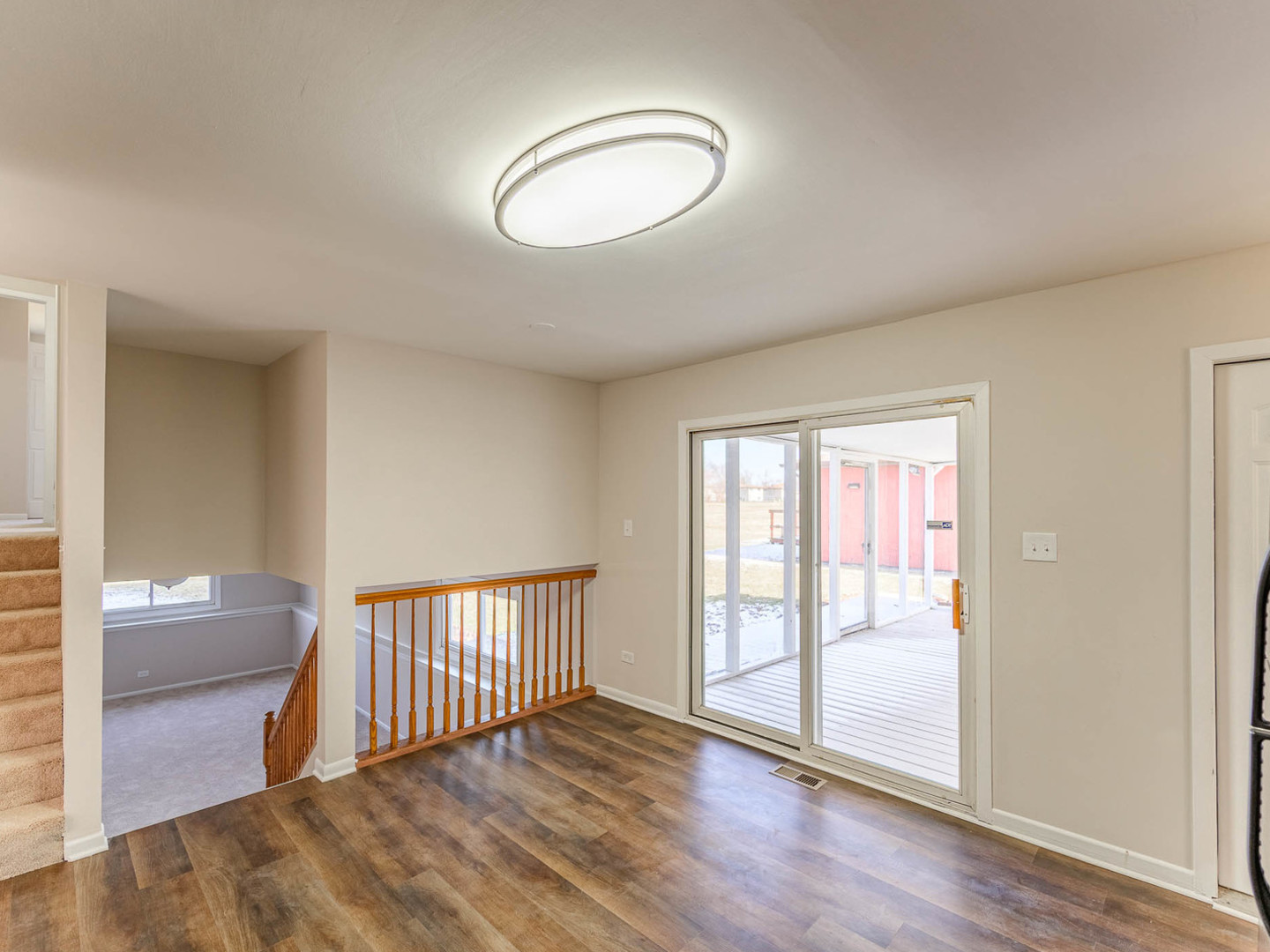 624 Farmview Road University Park, IL 60484 - Photo 6 of 16 a view of a room with wooden floor and windows
