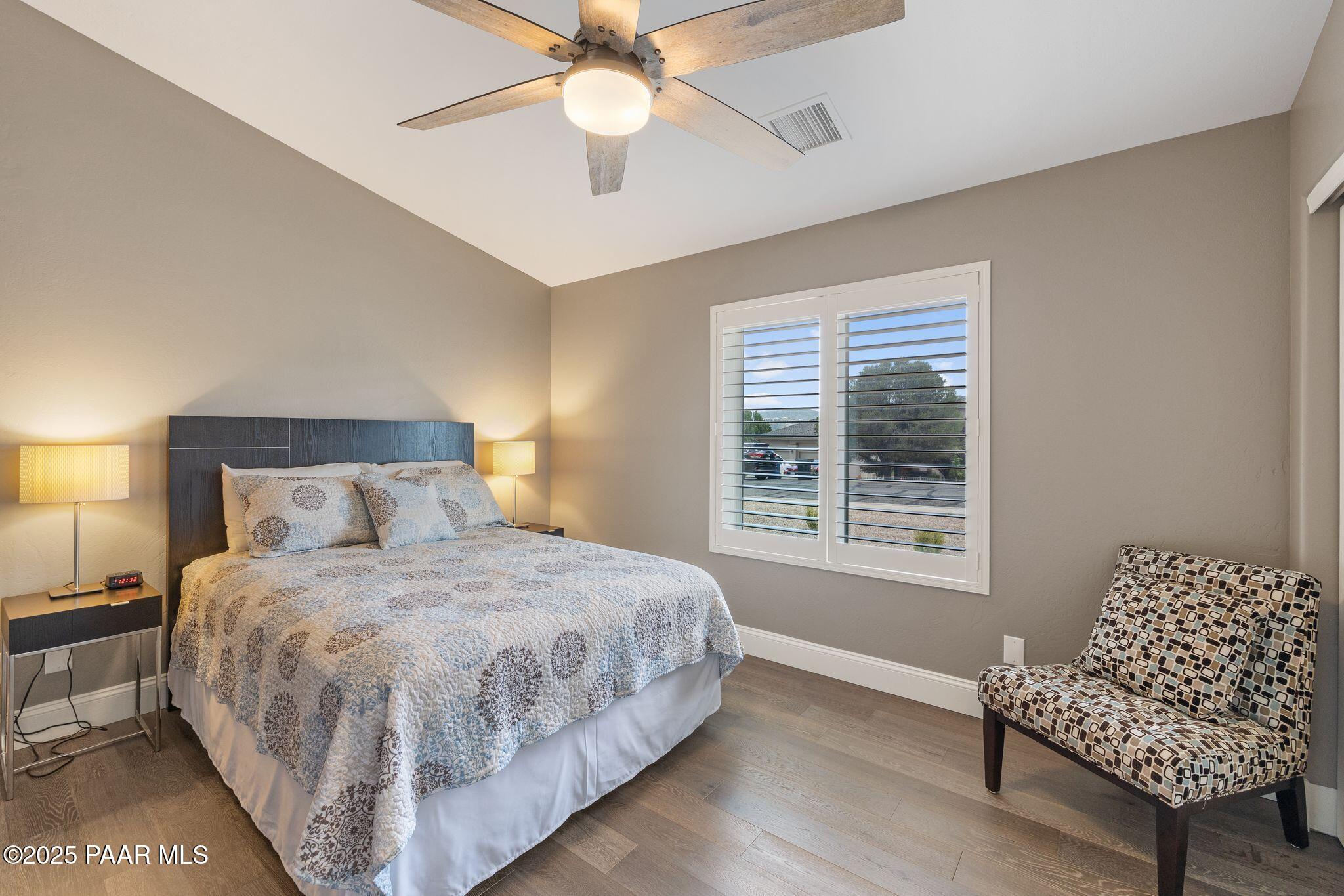 505 Miracle Rider Road Prescott, AZ 86301 - Photo 25 of 53 a bedroom with a bed couch and a window