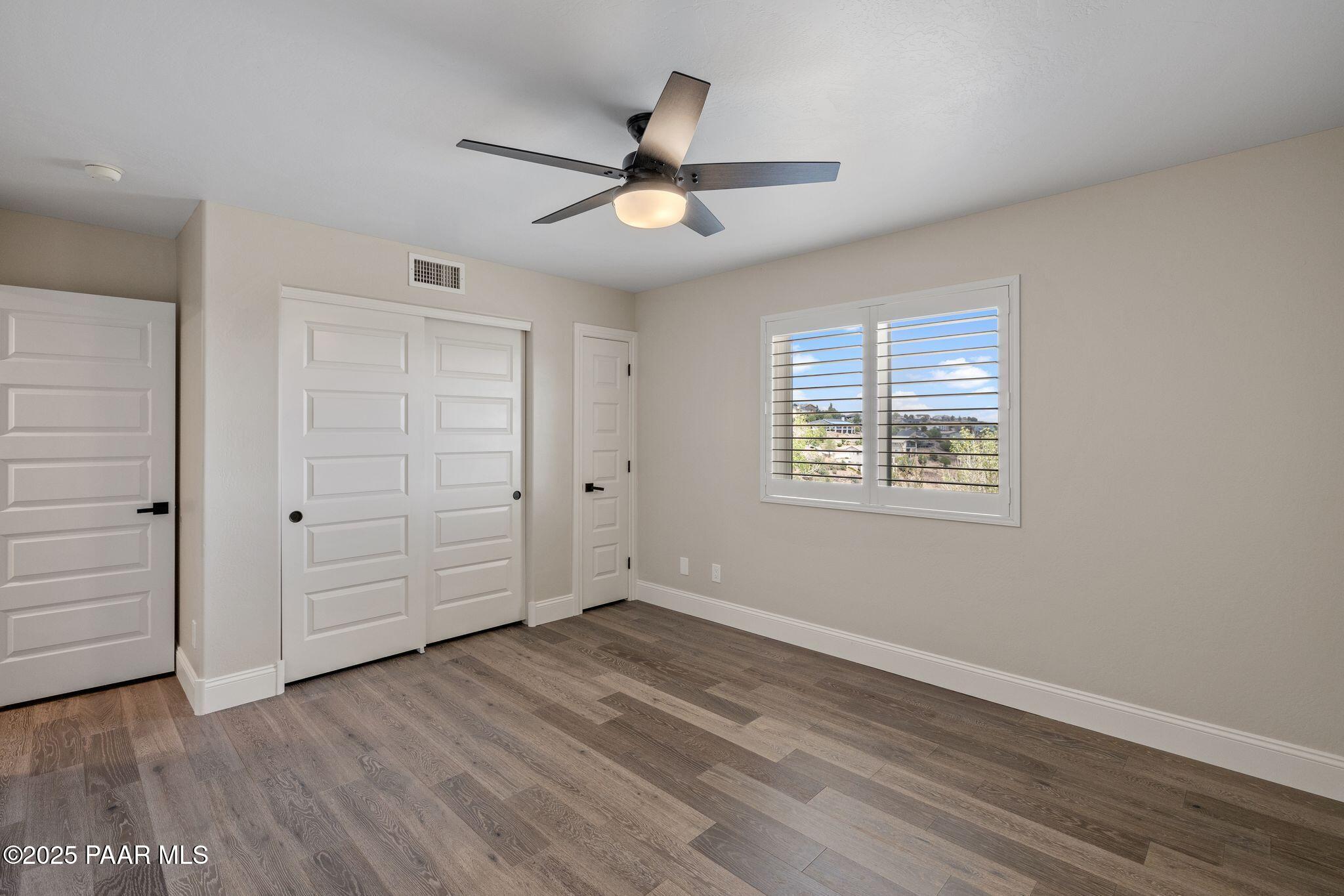 505 Miracle Rider Road Prescott, AZ 86301 - Photo 36 of 53 wooden floor in an empty room with a window