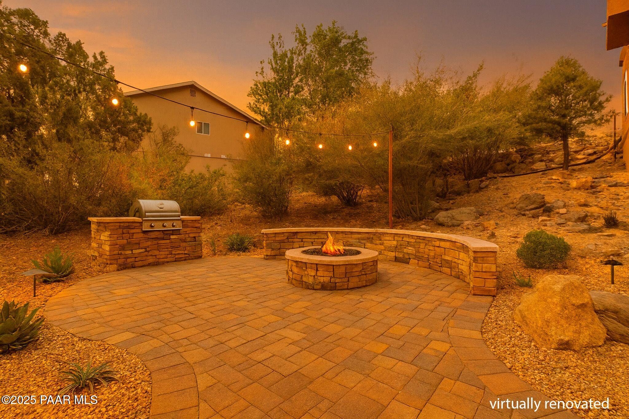 505 Miracle Rider Road Prescott, AZ 86301 - Photo 46 of 53 a backyard of a house with table and chairs